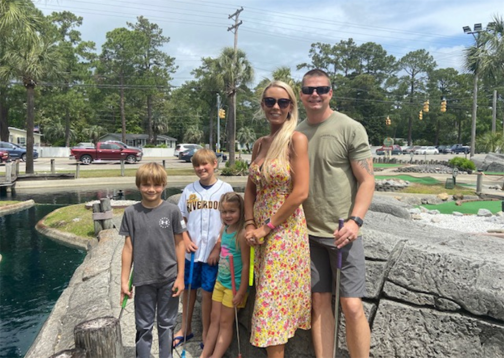 Summerville, S.C. Warehouse Manager Nicholas Essenmacher with his wife and children.